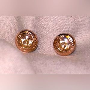 Rose gold Coach studs